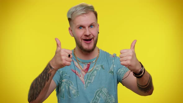 Stylish Tourist Man in Tshirt Showing Thumbs Up and Nodding in Approval Successful Good Work