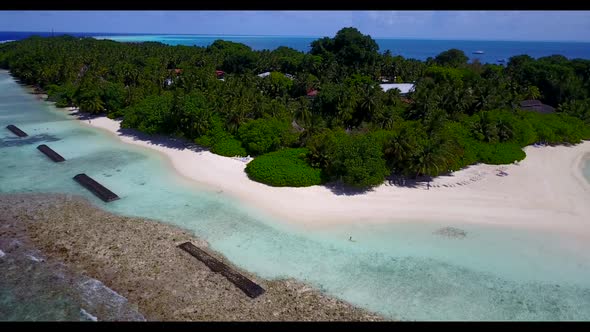 Aerial flying over landscape of tropical seashore beach trip by clear water with clean sand backgrou