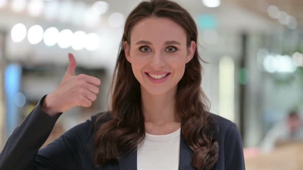 Portrait of Positive Businesswoman with Thumbs Up Sign