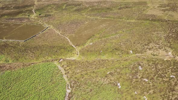 Aerial view of dirt road for off road activities in Dartmoor National Park, England.