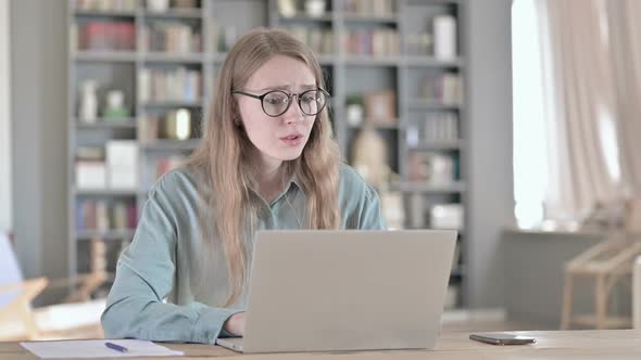 Shocked Woman Getting Upset While Sitting in Office