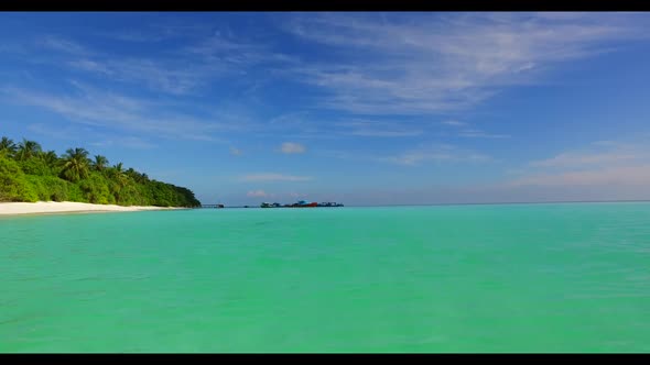 Aerial top down landscape of relaxing island beach adventure by aqua blue water with white sandy bac