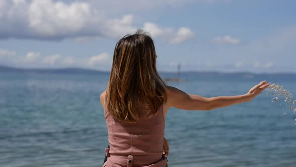 Dolly Slide Movement Of Young Woman Sitting On The Beach