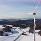 Aerial shot of rotating wind turbines during sunset. - VideoHive Item for Sale