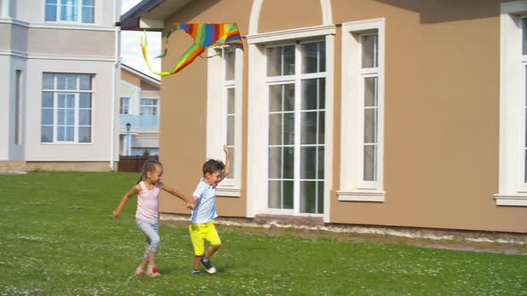 Children Flying Colorful Kite