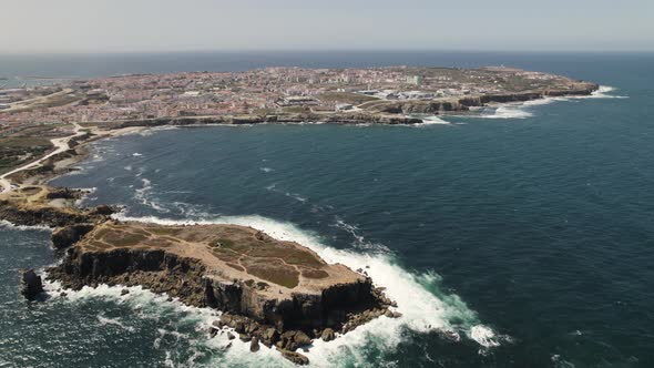 Scenic high angle view of Ilheu da Papoa, Peniche city in background