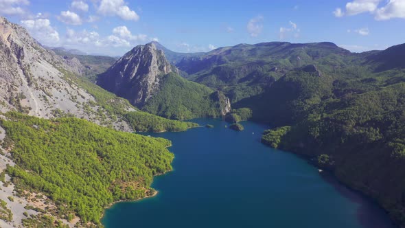 Aerial View on a Lake Among Mountain Cliffs in the Area of the Oymapinar Dam. Landscape of Green