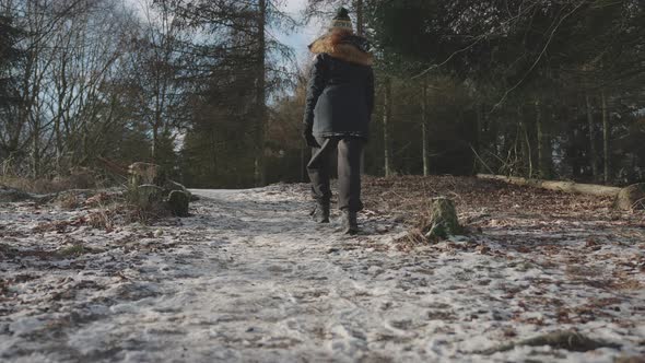 Full Shot Of A Person Walking Towards The Forest