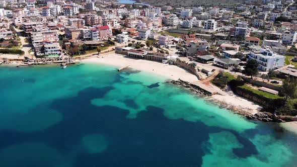 Aerial View of a White Sandy Beach Without People on a Sunny Day on the Ionian Sea