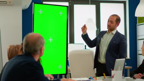 Young Man Leader of Company Presenting Financial Strategy Using Green Screen