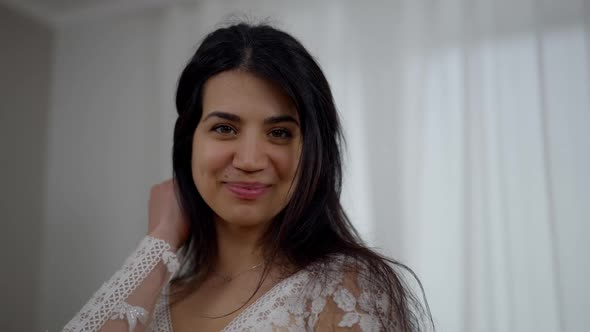 Closeup Portrait of Happy Smiling Young Middle Eastern Woman in White Beautiful Wedding Dress Posing