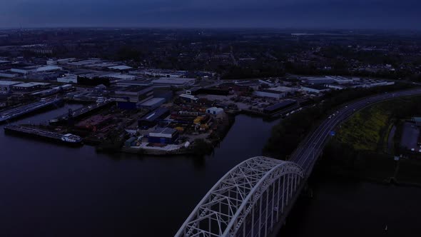 Top View Of The Arch Of Bridge Over The Noord In The Netherlands. descending drone shot