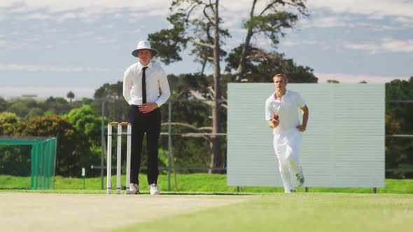 Cricket player throwing a ball as far as possible