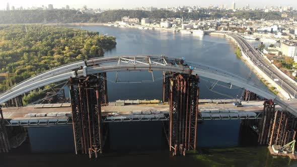 Aerial View of the Unfinished PodolskoVoskresensky Bridge Across the Dnieper River in Kiev Ukraine