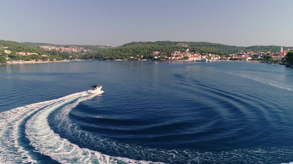 Aerial view of speed boat sailing at Adriatic sea near Brac island, Croatia.