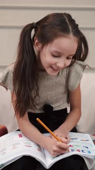 Preschooler Little Girl Drawing in Living Room