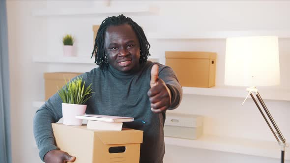 Happy Young African American Black Man Relocating to New House