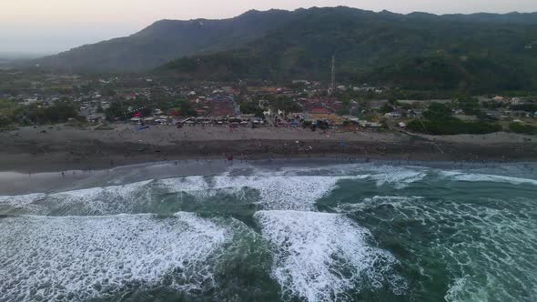 Aerial panorama of Parangkusumo beach on Java island during kite festival