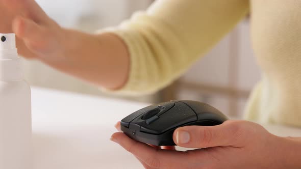 Close Up of Woman Cleaning Computer Mouse