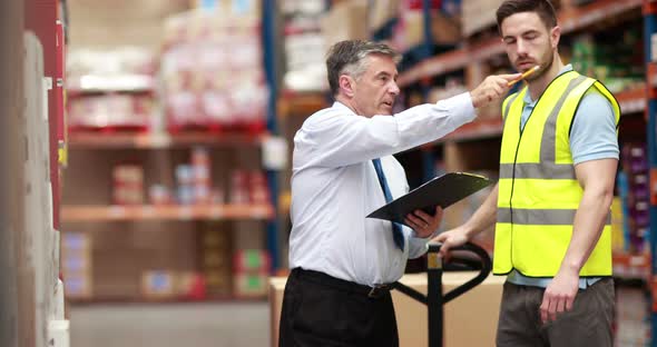 Warehouse Worker Talking with his Manager