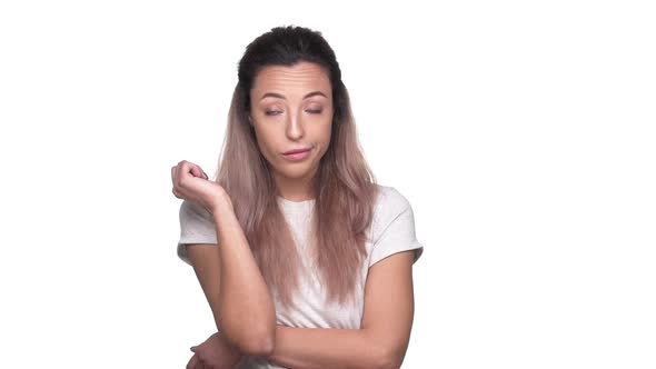 Studio Portrait of Caucasian Woman in Casual Tshirt Expressing Boredom or Disinterest While