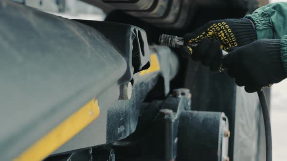 An Employee of the Agricultural Company Connects Bought Power Supply of Large Equipment