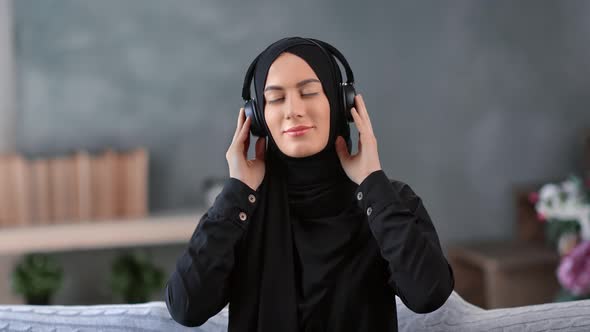 Portrait Happy Muslim Woman Posing in Headphones Dancing Enjoying Sound