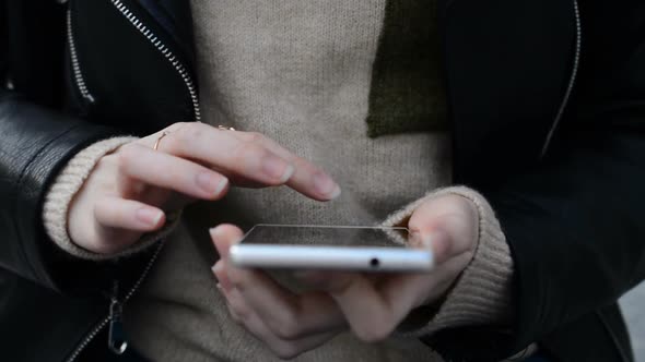 Front View of Female Hands Chatting in Smartphone