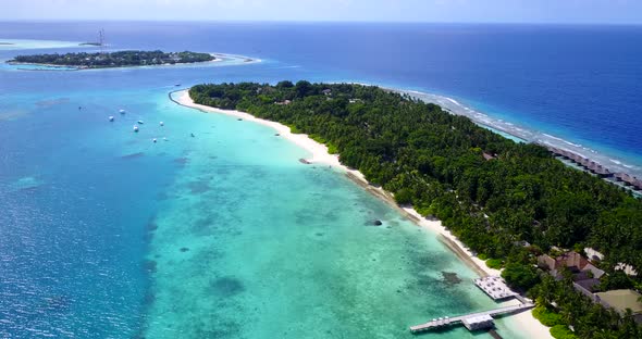 Natural drone clean view of a white sandy paradise beach and aqua blue ocean background in high reso