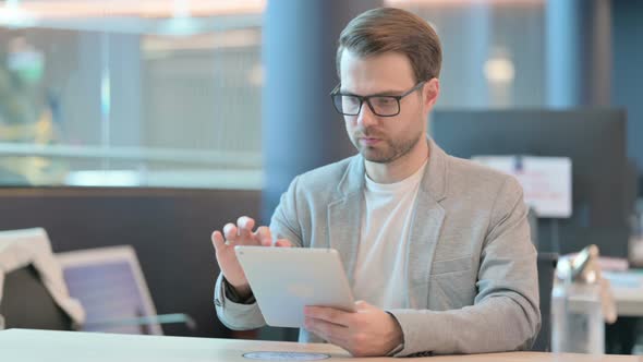 Man using Tablet in Office