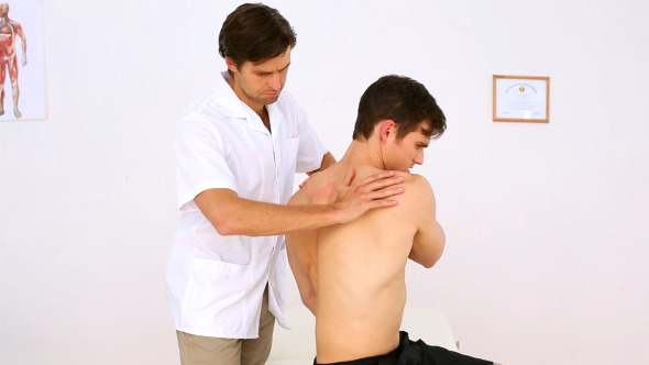 Physiotherapist Checking Patients Injured Shoulder 2