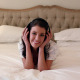 Beautiful Brunette Lying On Bed Listening To Music - VideoHive Item for Sale