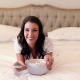 Beautiful Brunette Lying On Bed Eating Popcorn - VideoHive Item for Sale