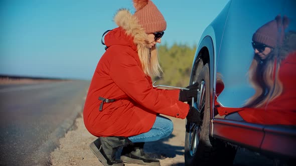 Woman Check Car Tire Pressure. Vehicle Trouble On Road On Vacation Trip. Female Trying Fix Car Tire.