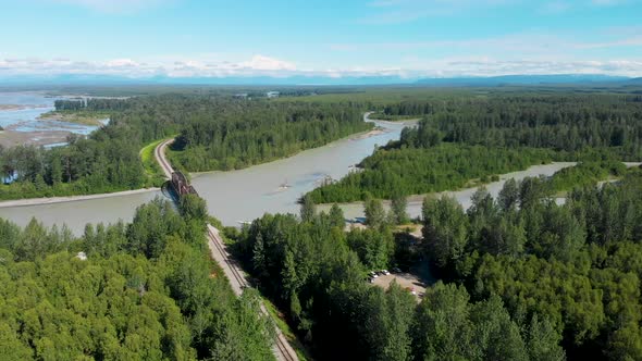 4K Drone Video of Alaska Railroad Train Trestle with Mt. Denali in Distance during Summer