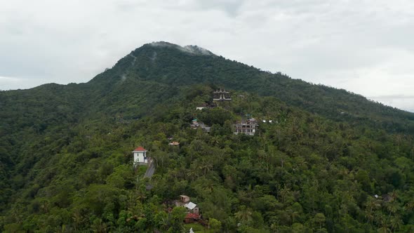 Aerial View of Hindu Temple and Rural Houses at the Foot of a Mountain in Bali