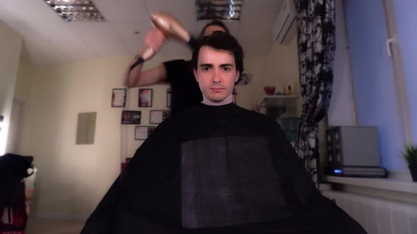 Portrait of a Male Client in a Barbershop Looking at the Camera, Time Lapse