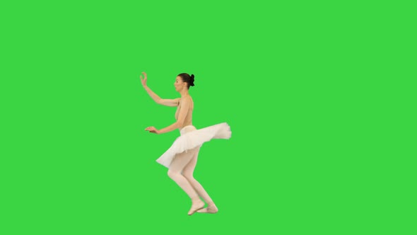 Young Ballerina Performing Grand Jete on a Green Screen Chroma Key