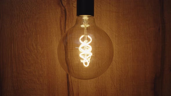 Light bulb over wooden background