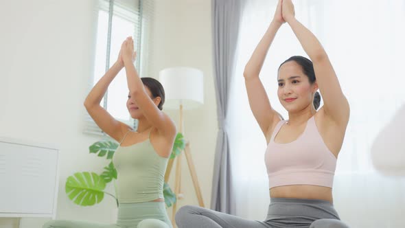 Asian active sport woman learn yoga pilates lesson with coach trainer.