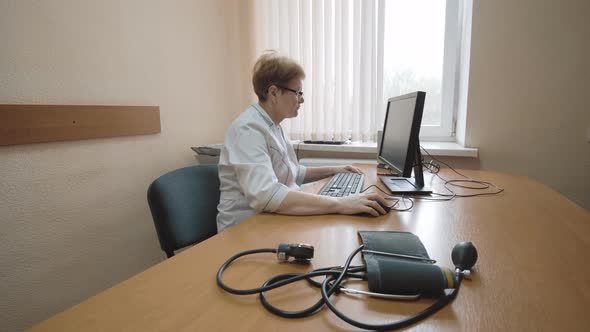 Doctor typing on the computer. Doctor in the office.Hospital and medicine.