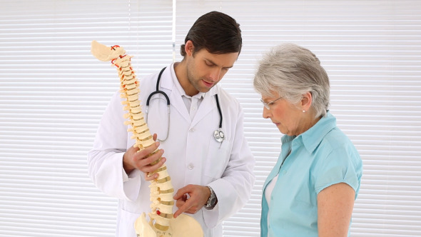 Chiropractor Explaining Spine Model