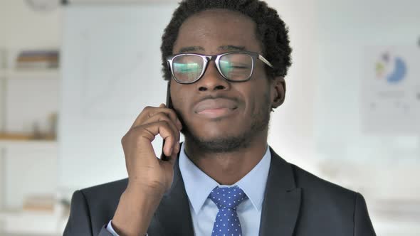 African Businessman Talking on Phone