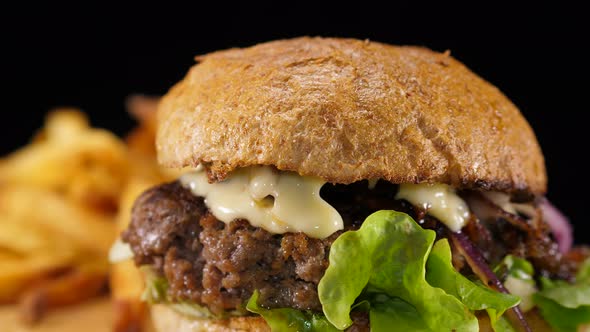 Big Special Beef Burger with Fries Close Up Shot