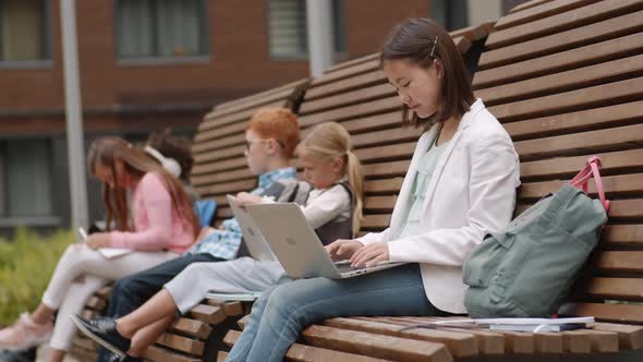 Portrait of Asian Girl Using PC during Break