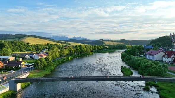 Aerial view of the bridge and the High Tatras in the village of Cerveny Klastor in Slovakia