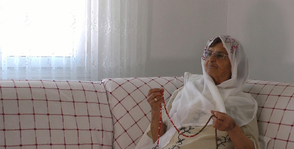 Old Woman Prays with Rosary 3