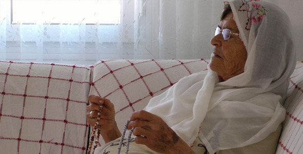 Old Woman Prays with Rosary 8