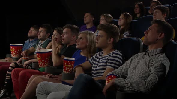 Young People Watch Movies in Cinema: Horror