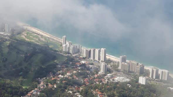 Foggy View Of Modern City  Buildings In Rio de Janeiro By The Mountainside - aerial shot